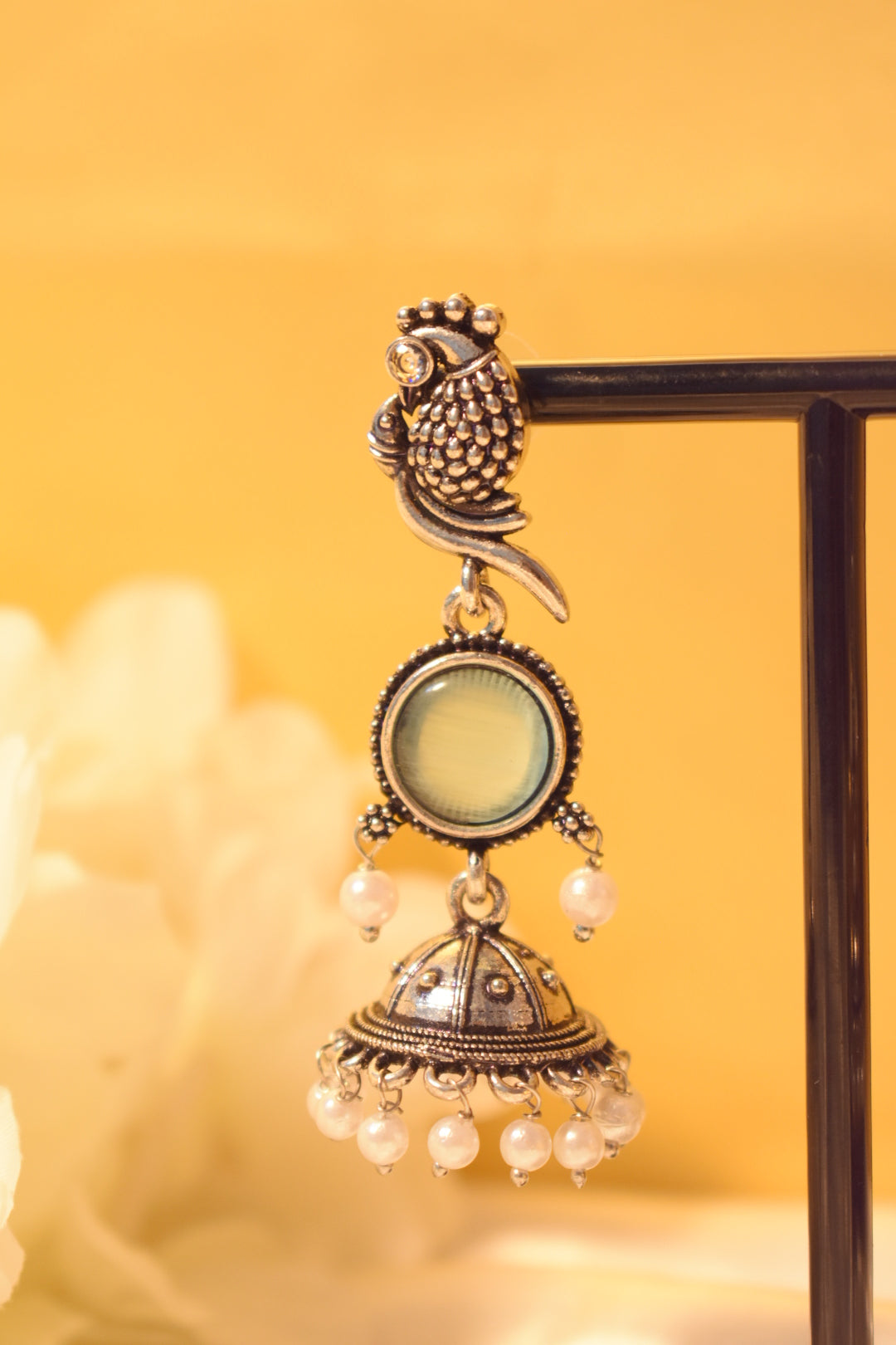 Peacock silver dangle earrings with mint stone