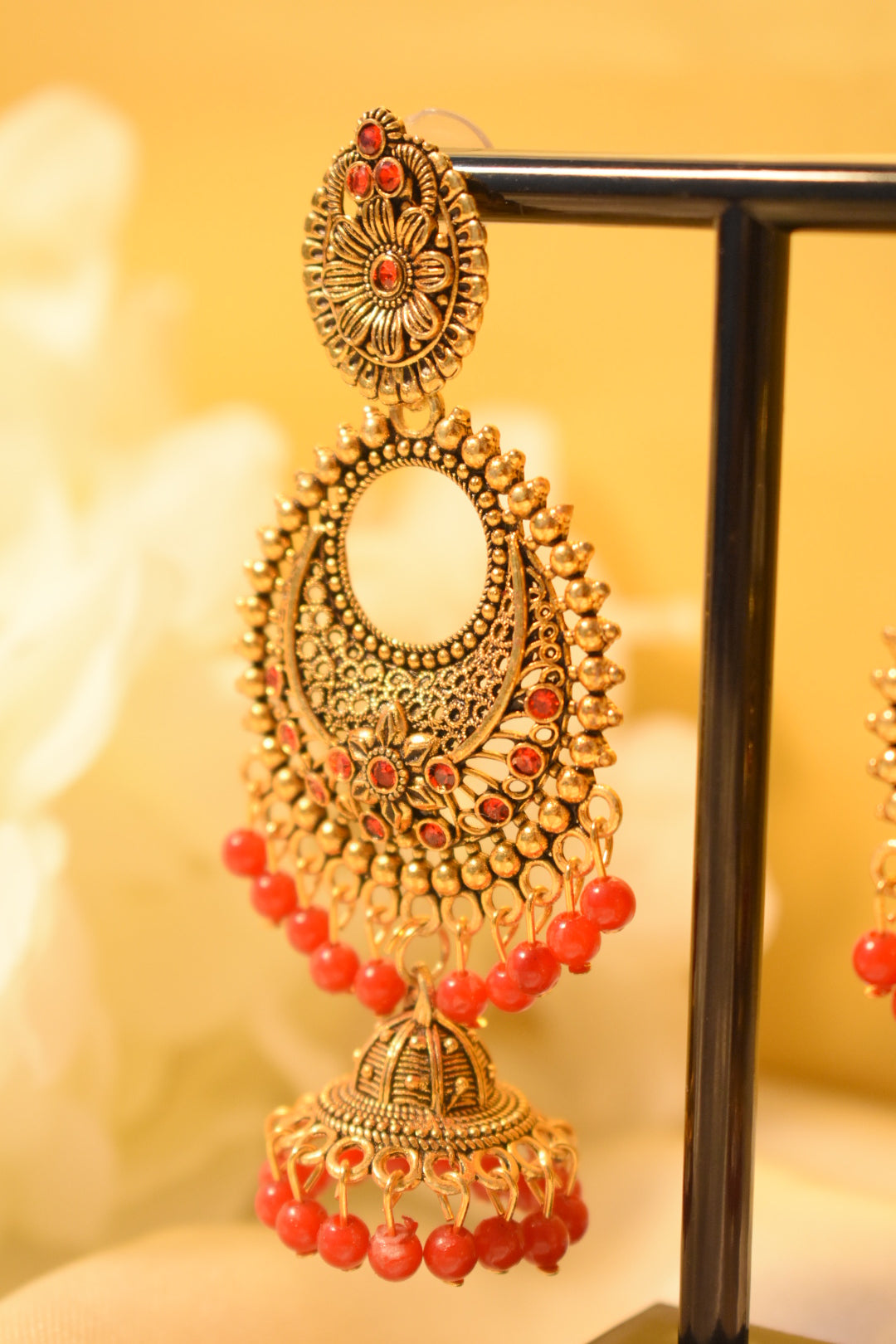 Gold-Tone Jhumka Earrings with Red Detailing