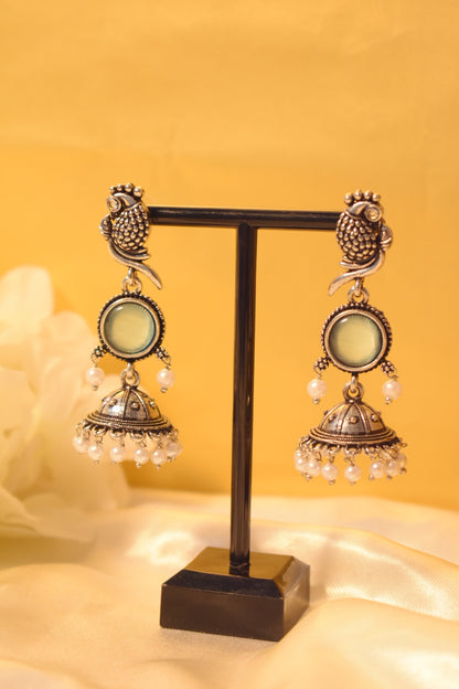 Peacock silver dangle earrings with mint stone