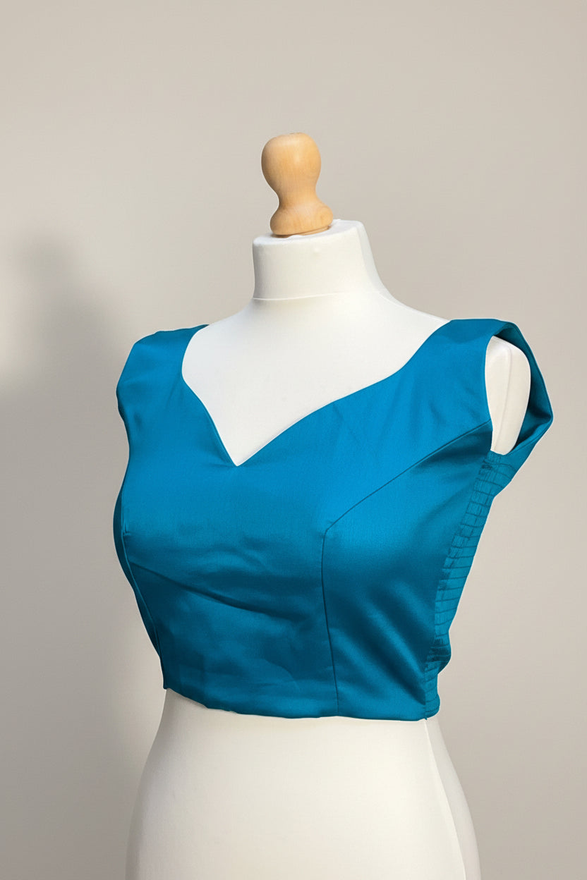 Stretchable Readymade Blouse with a tie-back design.