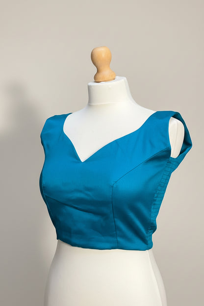 Stretchable Readymade Blouse with a tie-back design.