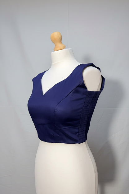 Stretchable Readymade Blouse with a tie-back design.